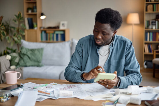 A person calculating his expenses