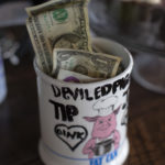 Tip jar with cash inside