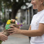 Woman receiving a bouquet of flowers