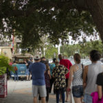 Line of customers waiting to shop at bouquet truck