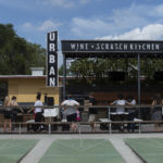 Storefront image of Urban Brew and BBQ restaurant featuring shuffleboard court