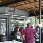 Customers standing in line to place order at restaurant