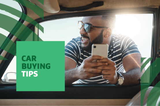 "Car Buying Tips" text over image of a man wearing sunglasses and holding a phone leaning into a car window