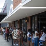 Line of customers waiting to get in business