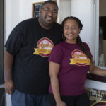 Man and woman smiling for camera