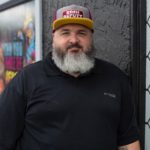 Man with beard smiling for camera