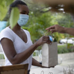 Customer receiving a business giftbag