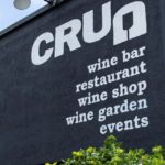 Mural of storefront stating "wine bar, restaurant, wine shop, wine garden, events"