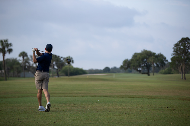 Golfer tees off at the Chief's Group Golf Tournament at MacDill Air Force Base