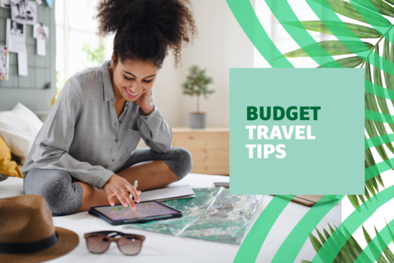Woman smiling and looking down at a map on a tablet with "Budget Travel Tips" text overlayed