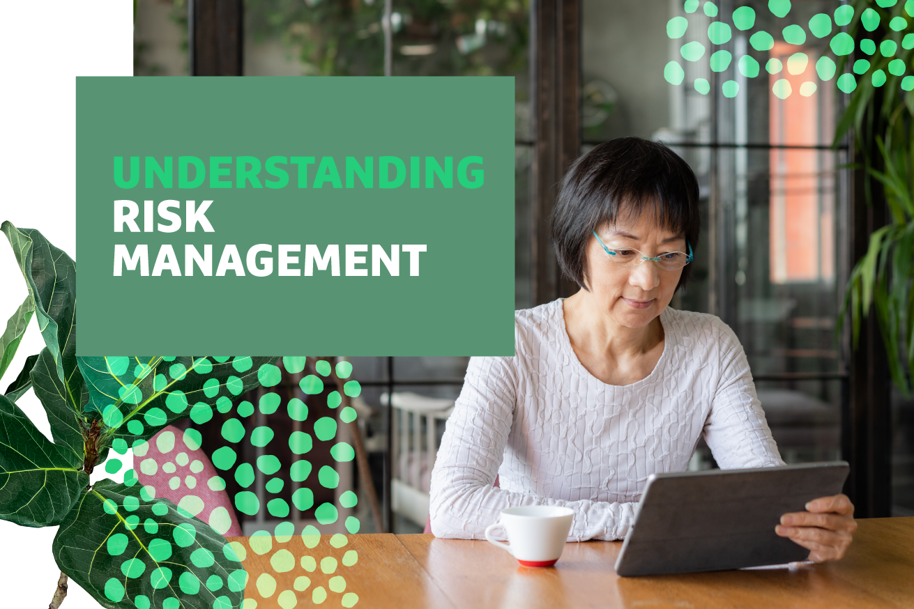 "Understanding Risk Management" text over image of a woman sitting at a desk working at a laptop