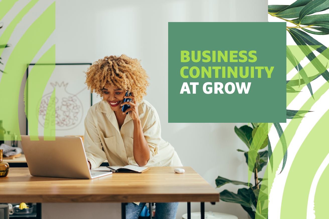 Woman standing at a table talking on the phone with "Business Continuity at Grow" text overlayed
