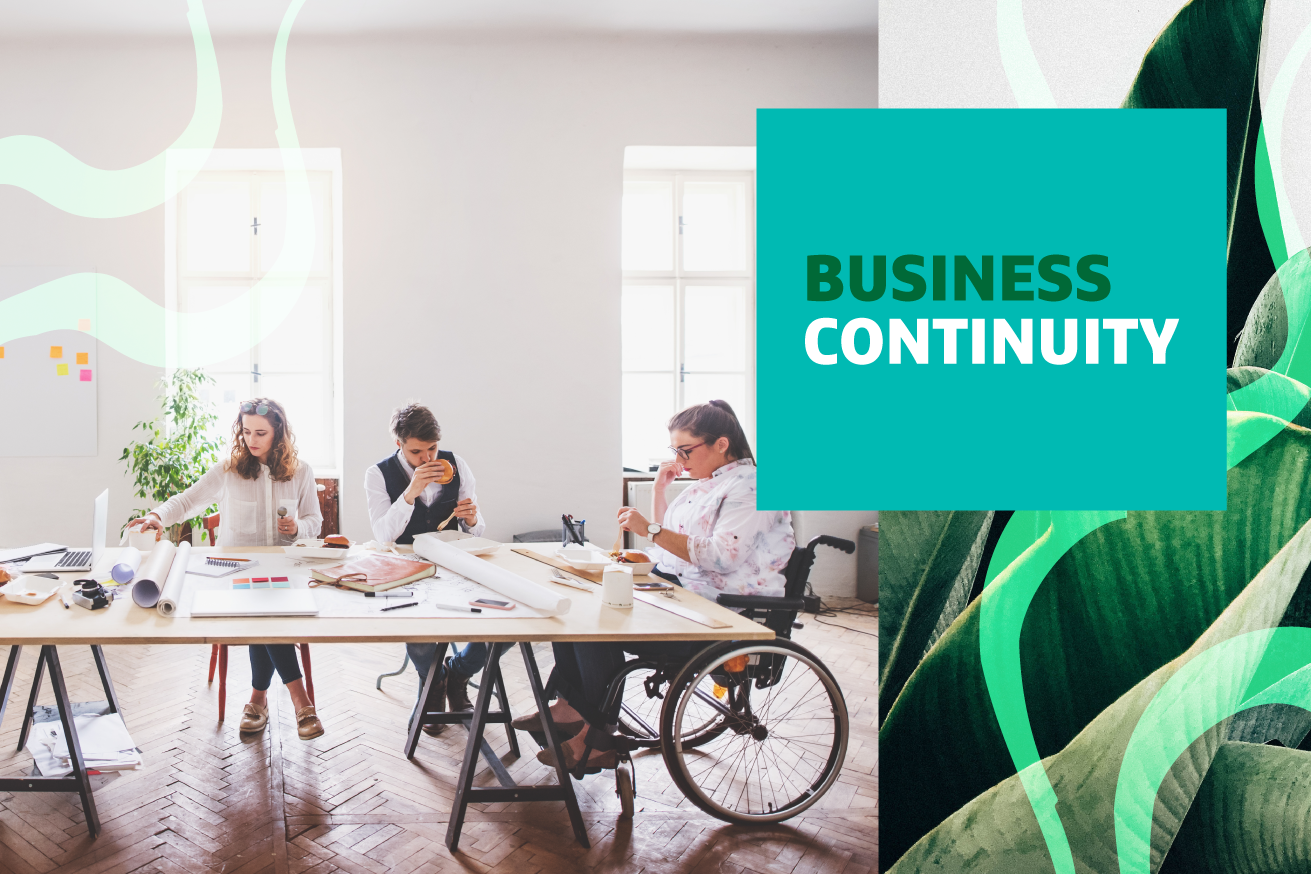 Three people sitting at a table working with "Business Continuity" text overlayed