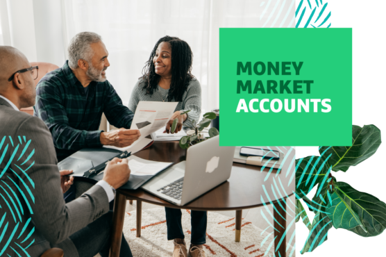Three people sit at a table smiling while looking at paperwork with "Money Market Accounts" text overlayed.