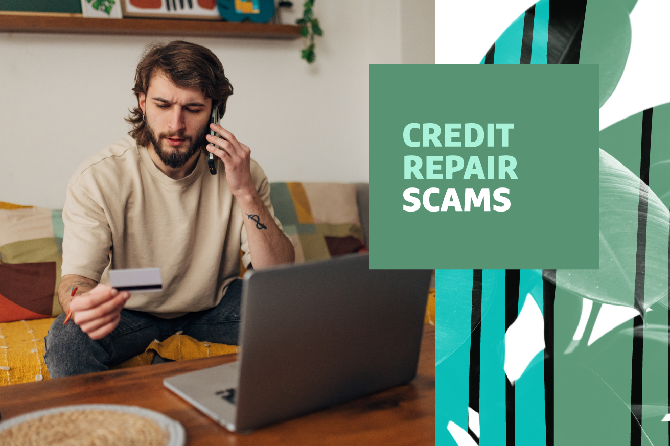 Man sitting on couch in front of laptop computer on cell phone discussing the credit card he is holding.