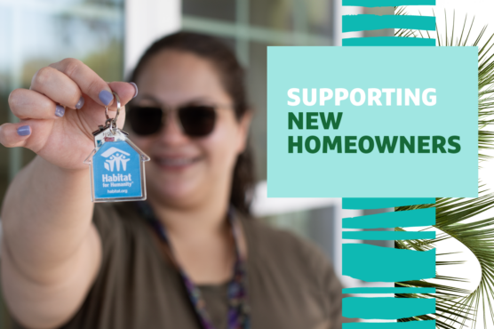 Smiling woman holding up keys to her new home with Habitat for Humanity keychain and "Supporting New Homeowners" text overlaid.