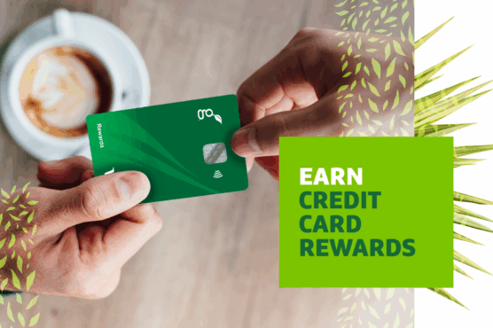 Person holding a green credit card over a table with a cup of coffee, next to a graphic overlay saying "EARN CREDIT CARD REWARDS."