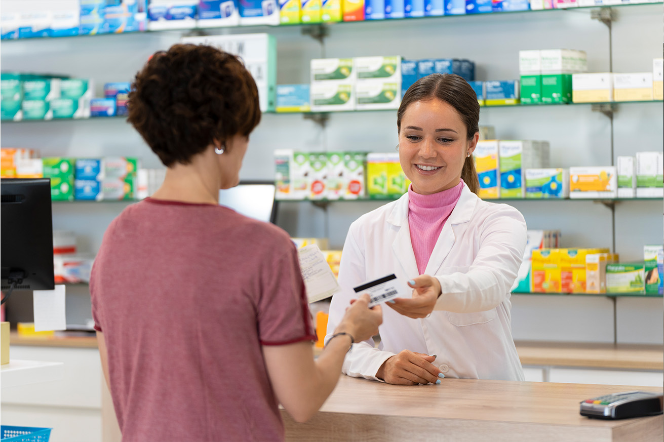 Woman making transaction at pharmacy