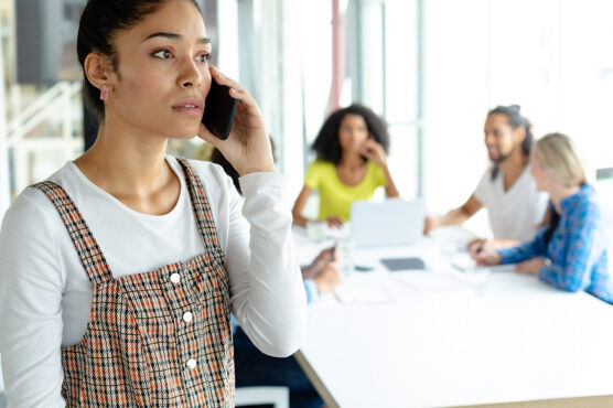 Woman looking concerned while talking on a smartphone