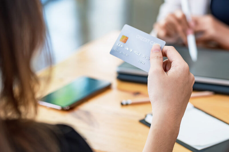 Woman checking her credit card details